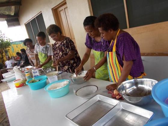 Interested Literacy Students learn baking methods under the Life Skill Program at Anglicare PNG POM Branch. August 2014