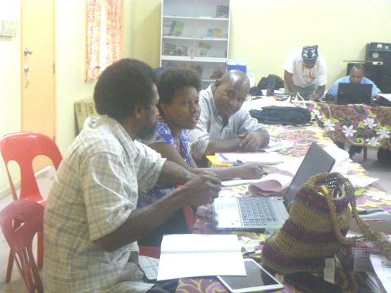 Stephen Raurela (L) with participants of the APNG Planning meeting, at discussion time. January 2015