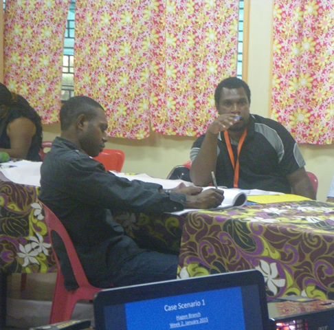 Michael Ambo, M& Hagen & Aquino Saklo POM Adult Literacy Manager during discussion time. Anglicare Planning Workshop in POM. January, 2015.