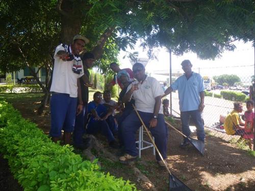 Students of 12 Rinaldi, Don Bosco Technical School, Gabutu, take time out after 5 hours of work.They are part of a class of 42 students who cleaned up the Anglicare Pom and Good Shepherd yard recently in Port Moresby under their SALT Program.