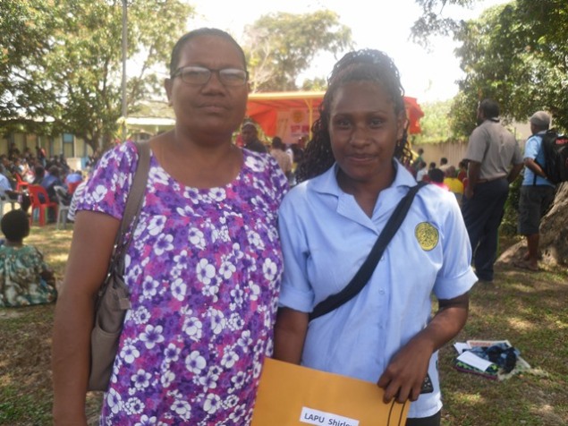 Teacher Roselyn James (R) proudly stands by one her learners Ms. Shirley Lapu after she graduated from the Works Training Centre with a level 1& 2 Certificate in Office Administration 